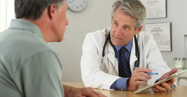 Person examining cholesterol test results